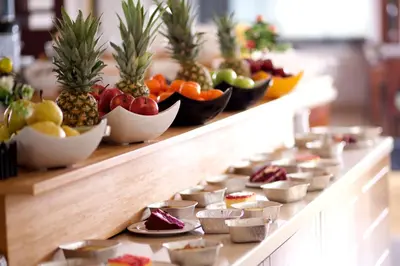a buffet line with fruits and vegetables in bowls at Mosaic Hotel Old City -Special Category in Istanbul