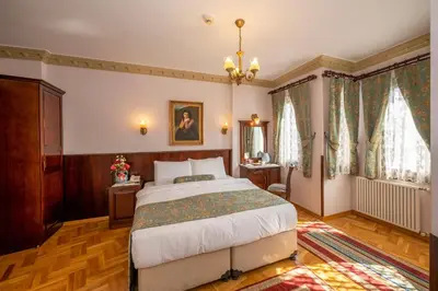 a bedroom with a large bed in a room at Osmanhan Hotel in Istanbul