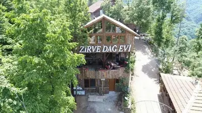 a building with a sign that reads zermk dagev at Zirve Dağ Evi in Kocaeli