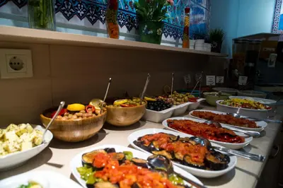 a buffet line with many different types of food at Tashkonak Studio Suites in Istanbul