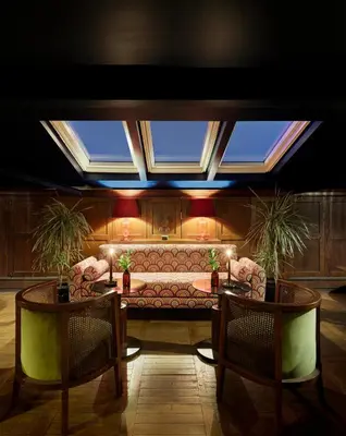 a living room with a couch and two tables at Mr Cas Hotels Taksim - Special Category in Istanbul