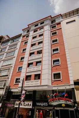 a tall building with a store in front of it at Yuksel Hotel in Istanbul