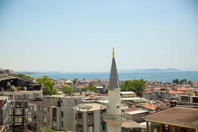 a view of a city with a church steeple at Yuksel Hotel in Istanbul