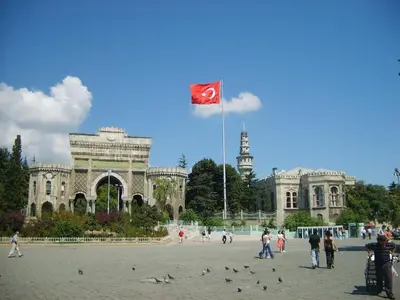 a kite flying in front of a building with a flag at Hotel Linda in Istanbul