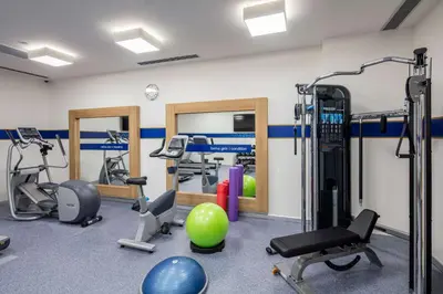 a gym with treadmills and exercise equipment at Hampton by Hilton Istanbul Zeytinburnu in Istanbul