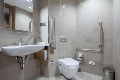 a bathroom with a toilet and a sink at Hampton by Hilton Istanbul Zeytinburnu in Istanbul