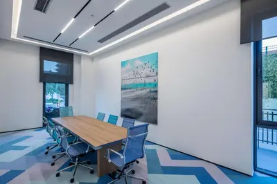 a conference room with a wooden table and chairs at Hampton by Hilton Istanbul Zeytinburnu in Istanbul