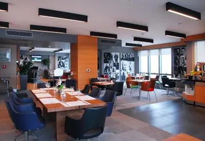 a restaurant with tables and chairs in a room at Point Hotel Barbaros in Istanbul