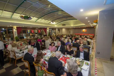 a group of people sitting at tables in a restaurant at Hotel Hegsagone Marine Asia in Gebze