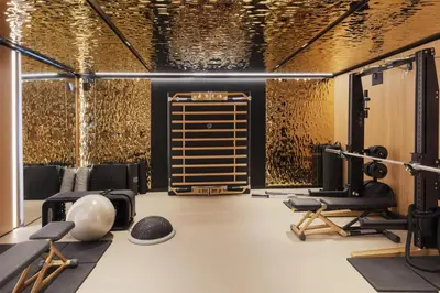 a gym with black and gold walls at Park Hyatt Istanbul - Macka Palas in Istanbul