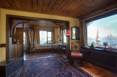 a room with a bedroom with a bed and a window at Hotel Empress Zoe in Istanbul