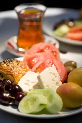 a plate of food with different types of cheese and fruit at Hotel Empress Zoe in Istanbul
