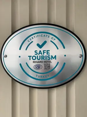 a sign for a safe tourism hazard hotel on a wall at Regard Hotel in Istanbul