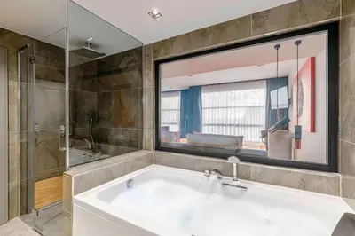 a large bathroom with a tub and a shower at AHC Taksim Hotel-Special Class in Istanbul