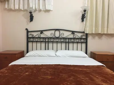 a bedroom with a large bed with white sheets at Side Hotel in Istanbul
