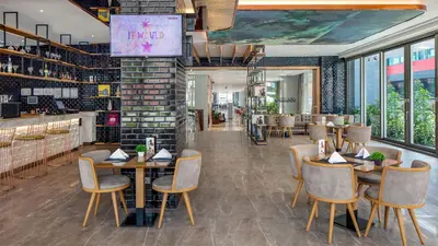 a restaurant with tables and chairs in a room at Lionel Hotel Istanbul in Istanbul