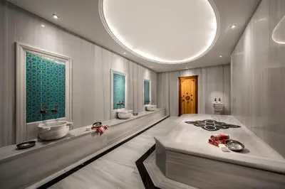 a bathroom with three sinks and two toilets at Lionel Hotel Istanbul in Istanbul