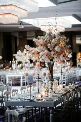 a long table with a bunch of flowers and candles at Lionel Hotel Istanbul in Istanbul