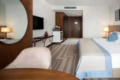 a hotel room with a bed and a mirror at Lionel Hotel Istanbul in Istanbul