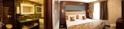 a hotel room with a bed and a bathroom at Ilkbal Deluxe Hotel &Spa Istanbul in Istanbul