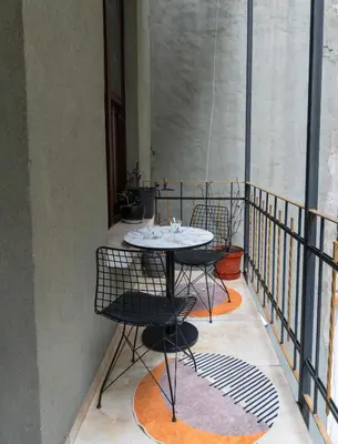 a table and chairs sitting on a balcony at Nest HOTEL Sisli in Istanbul
