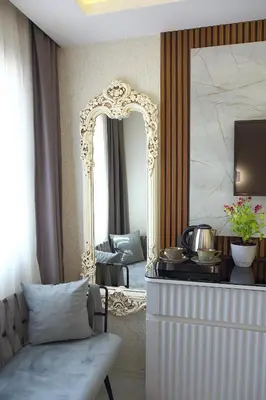 a living room with a mirror and a couch at AMARA OLD CITY HOTEL & Spa in Istanbul