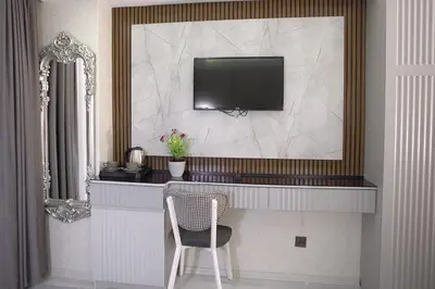 a room with a desk with a television and a chair at AMARA OLD CITY HOTEL & Spa in Istanbul