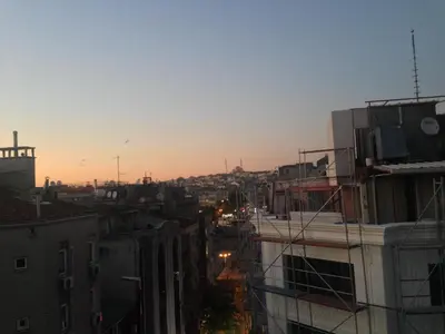 a view of a city skyline at sunset at Hotel Akkus in Istanbul