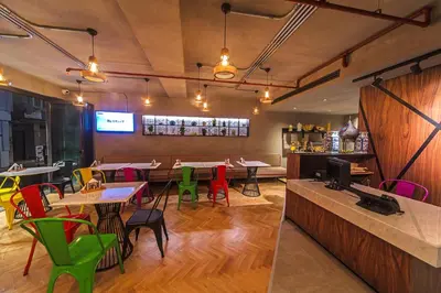 a restaurant with tables and chairs and a bar at Redmont Hotel Nisantasi in Istanbul