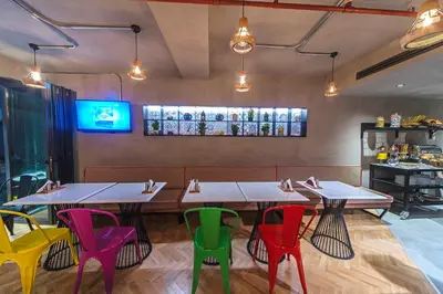 a dining room with tables and colorful chairs at Redmont Hotel Nisantasi in Istanbul