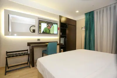 a hotel room with a bed and a tv at Milord Hotel in Istanbul