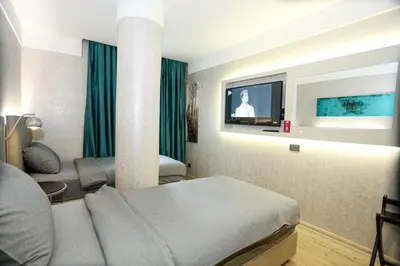 a hotel room with a bed and a tv at Milord Hotel in Istanbul