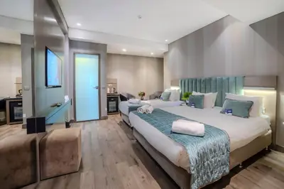 a large bedroom with two beds in a room at The Tango Hotel İstanbul in Istanbul