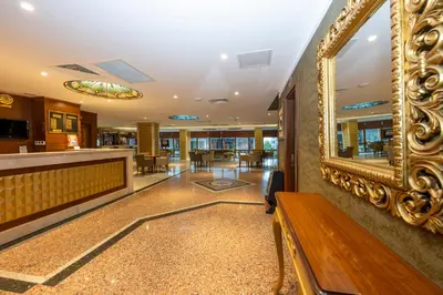 a lobby with a bench and a mirror at Dalan Otel in Istanbul