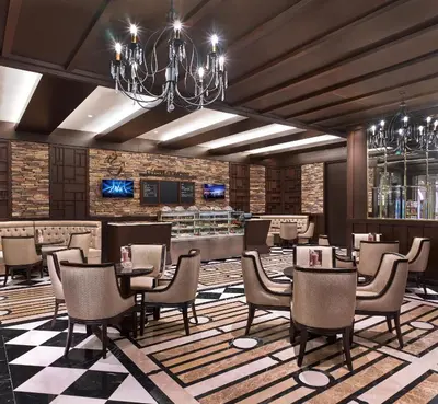 a restaurant with tables and chairs and a bar at Elite World Grand Istanbul Basın Ekspres in Istanbul