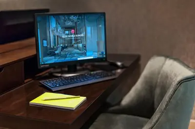 a desk with a computer monitor and a keyboard at Elite World Grand Istanbul Basın Ekspres in Istanbul