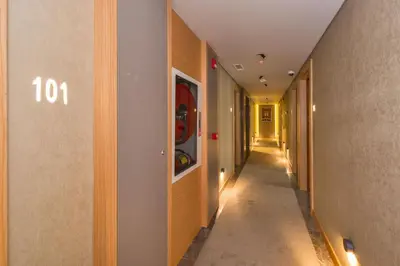 a hallway of a building with the number on the wall at Hotel Genova Istanbul Old City in Istanbul