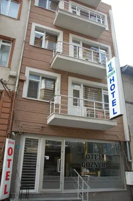a building with a sign in front of it at Göznur Otel in Bandırma