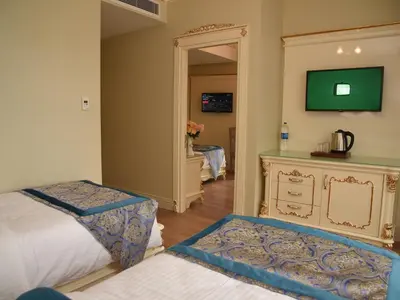 a bedroom with a bed and a mirror and a mirror at İstasyon Hotel in Istanbul