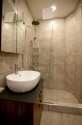 a bathroom with a white sink and a shower at Ferman Konak Hotel-Special Category in Istanbul