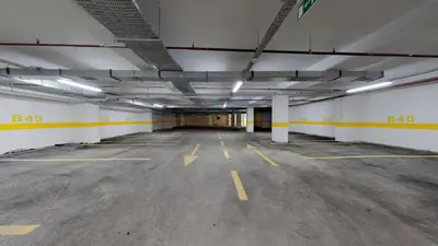 an empty parking lot in a parking garage at Zin D Home Dudullu Otel in Istanbul