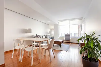 a white living room with a table and chairs at NOA - Sungu 1 in Istanbul