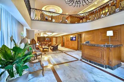 a large lobby with a reception desk and a living room at Adelmar Hotel Istanbul Sisli in Istanbul