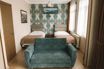 a living room with a couch and a chair at Green Life Apart Hotel in Istanbul