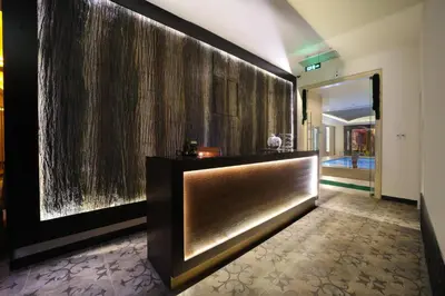 a lobby of a hotel with a large wall at The Time Hotel Marina in Istanbul