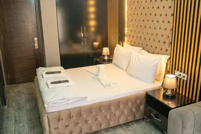 a bed in a hotel room with towels on it at Ömer Agah Istanbul Hotel Bayrampasa in Istanbul