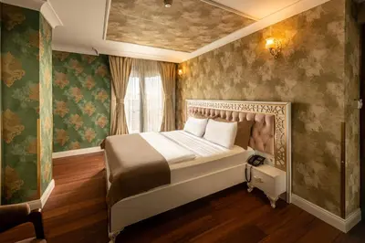 a bedroom with a bed in a room with a window at Golden Dream Otel in Istanbul