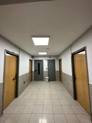 an empty hallway with doors and a toilet at Hotel Semih in Istanbul