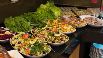 a buffet with many bowls of salads and other foods at Prestige Hotel Old City in Istanbul