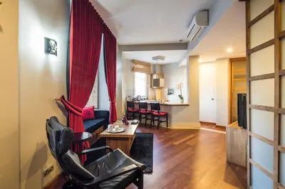 a living room with a couch and a table at Taxim Suites Residences Istanbul in Istanbul